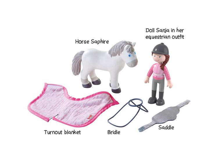 Horse Saphire with Doll Sanja and equestrian accessories on a white background
