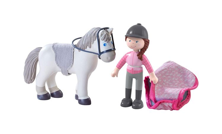 Dollhouse scale Toy horse and rider with a pink bag on a white background