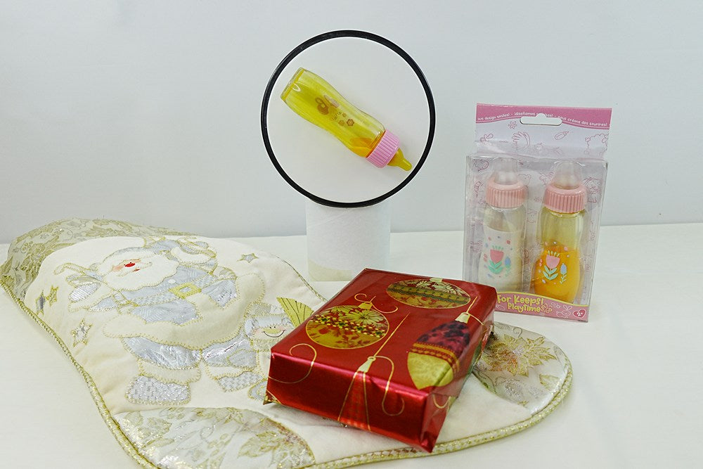 Image of Disappearing Milk and Juice Bottles in Stocking Stuffer Christmas Setting