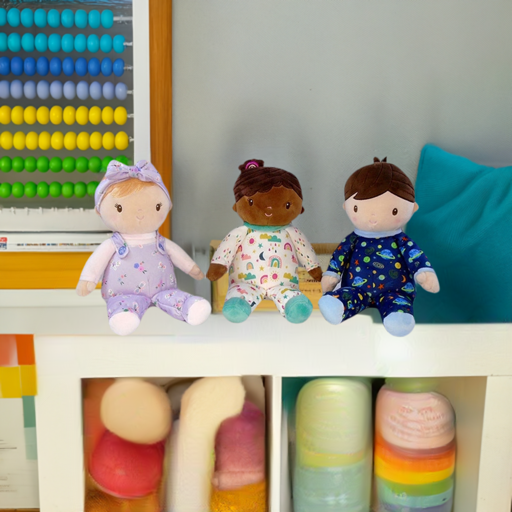 three soft rag dolls by Douglas Toy, A redhead rag doll, a black rag doll and a boy rag doll