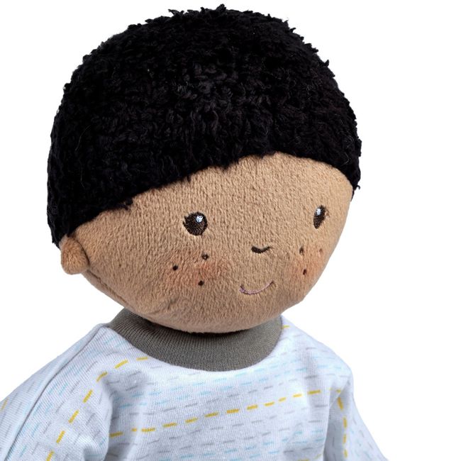 a close up portrait view of our black boy rag doll with natural hair