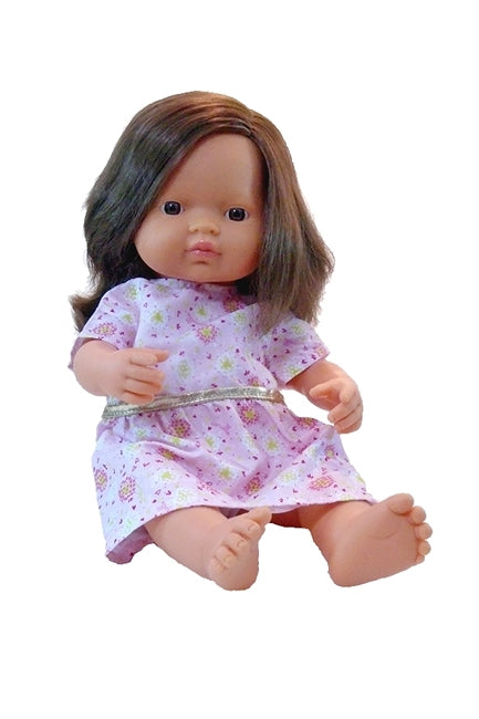 a 15 inch miniland educational doll in an empire style doll's dress