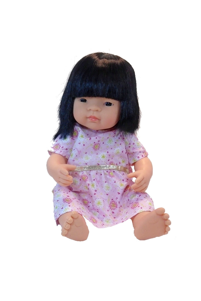a posable asian doll with brushable hair in a 15 inch doll's dress
