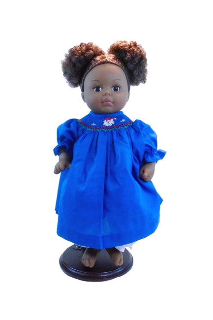 Madame Alexander Black doll with hair in santa clause doll's christmas dress