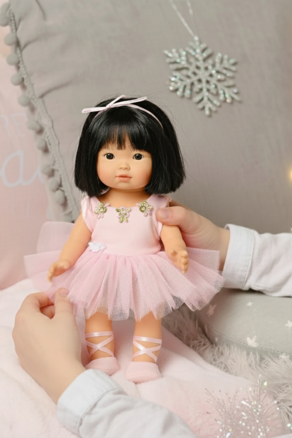 Dottie Aja Asian Ballet-themed doll in a pink dress with a decorative background