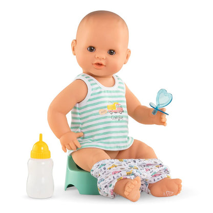 Corolle Baby Paul boy potty training doll sitting on teal potty chair holding blue pacifier with bottle nearby