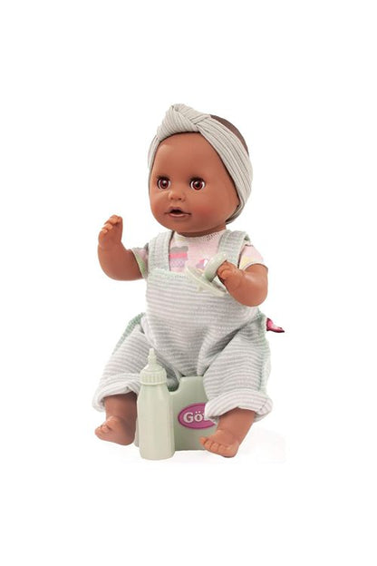 Black potty training Doll sitting on a potty seat