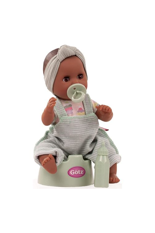 Baby doll with a pacifier sitting on a potty, wearing a gray outfit with a visible brand logo.