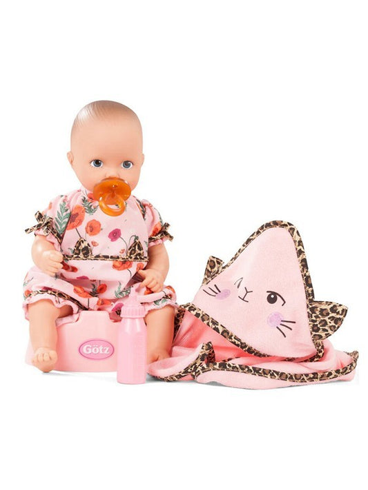 Baby doll with floral outfit, pacifier, and pink potty with leopard print towel on a white background