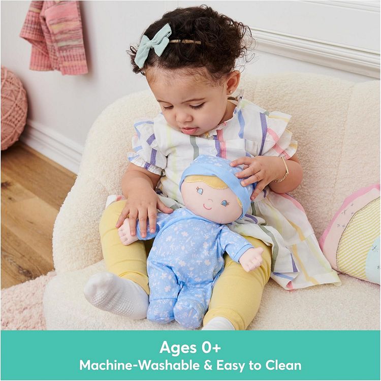 a young child holding a Baby Safe boy's first doll and lovey
