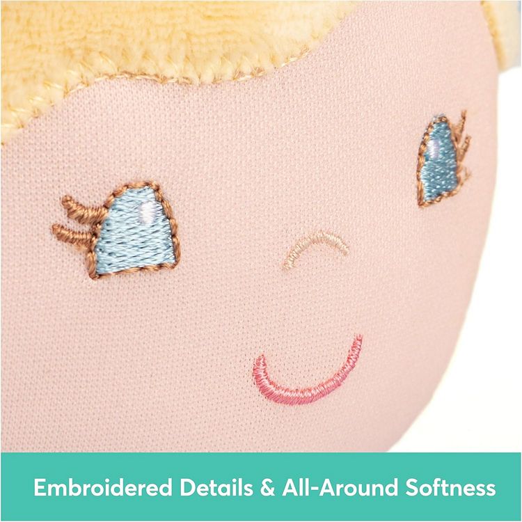 Close-up portrait of a plush toy with embroidered details made of 100% recycled material