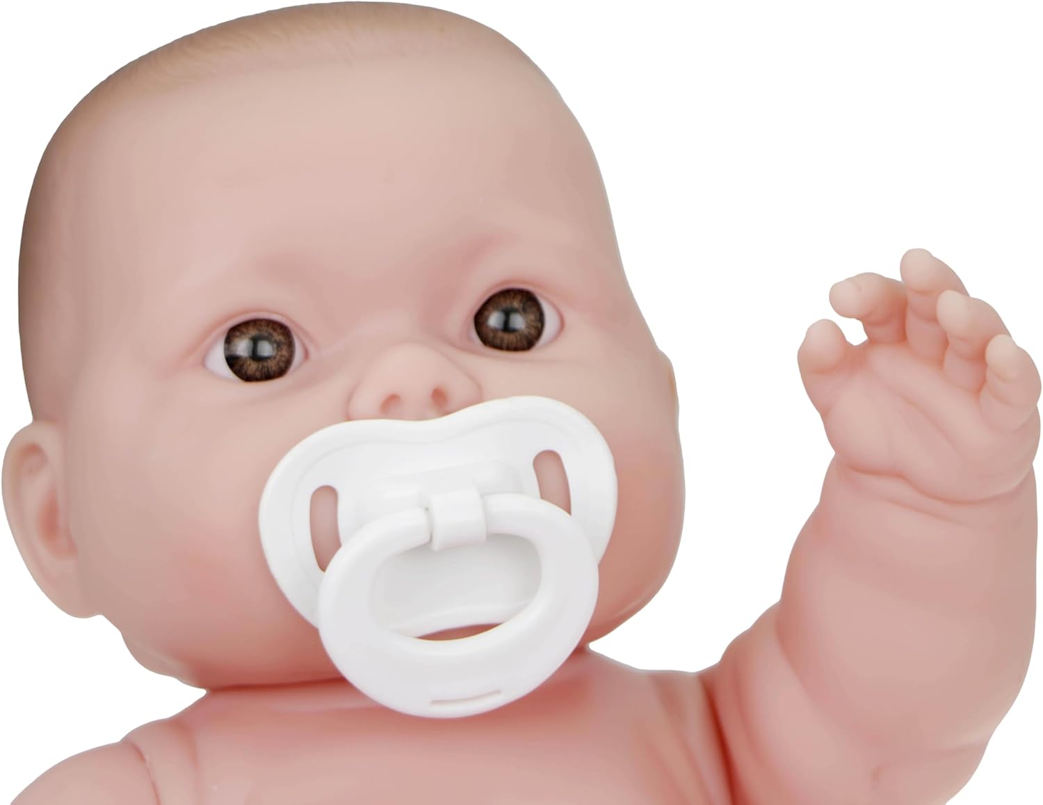 JC Toys Lots to Love baby doll close up with white pacifier and raised hand showing detailed brown eyes blushed cheeks and realistic soft vinyl face