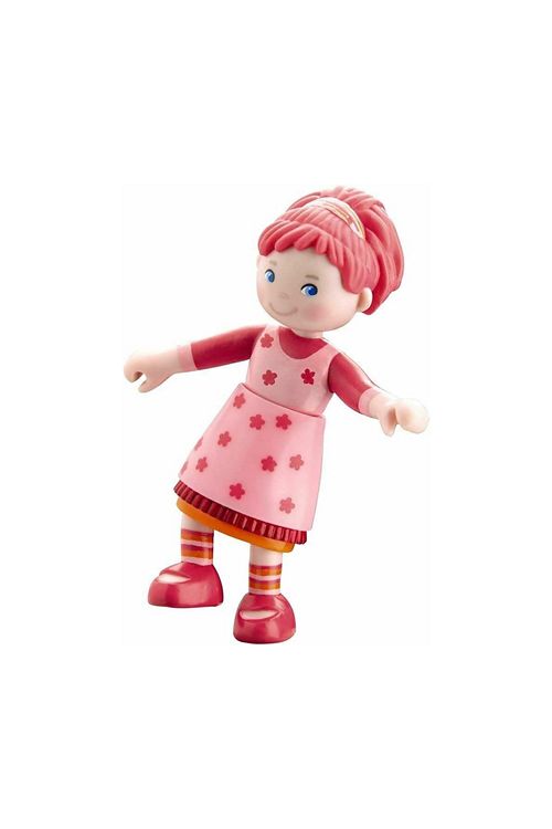 Tween dollhouse doll Toy figure with pink hair and dress on a white background