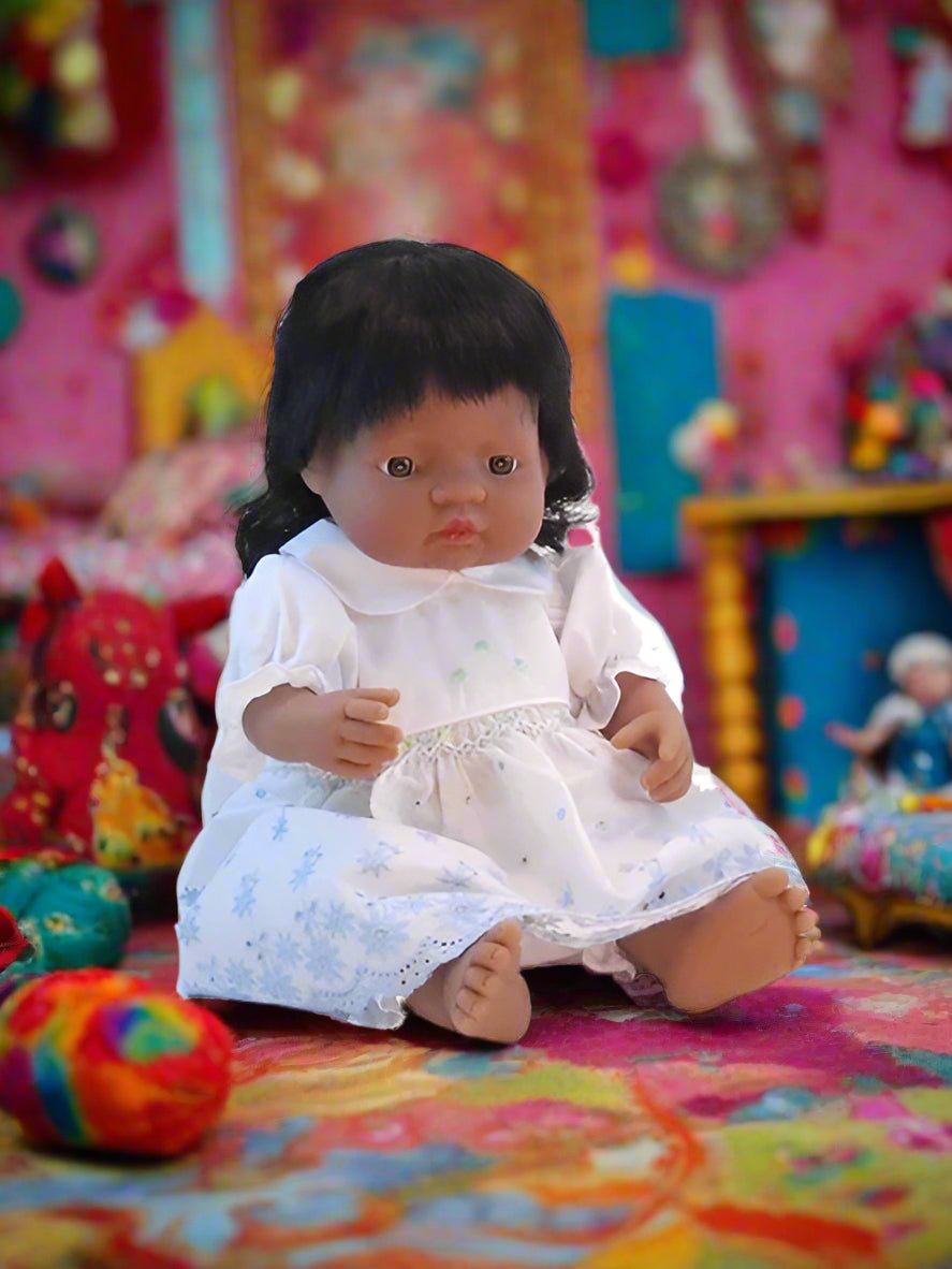 15 inch South Asian girl's doll in removable outfit.