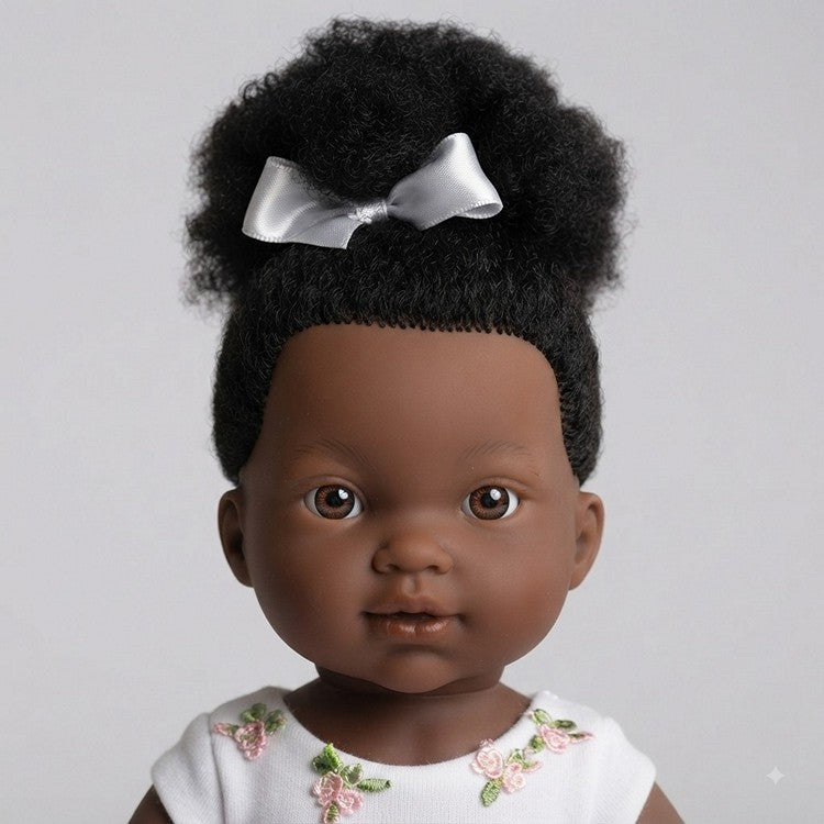 A close up portrait of the Zoe black ballerina doll for toddlers by Llorens