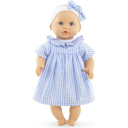 Corolle Calin Milly 12 inch baby doll standing full body view in blue gingham dress white headband with blue bow and open blue eyes