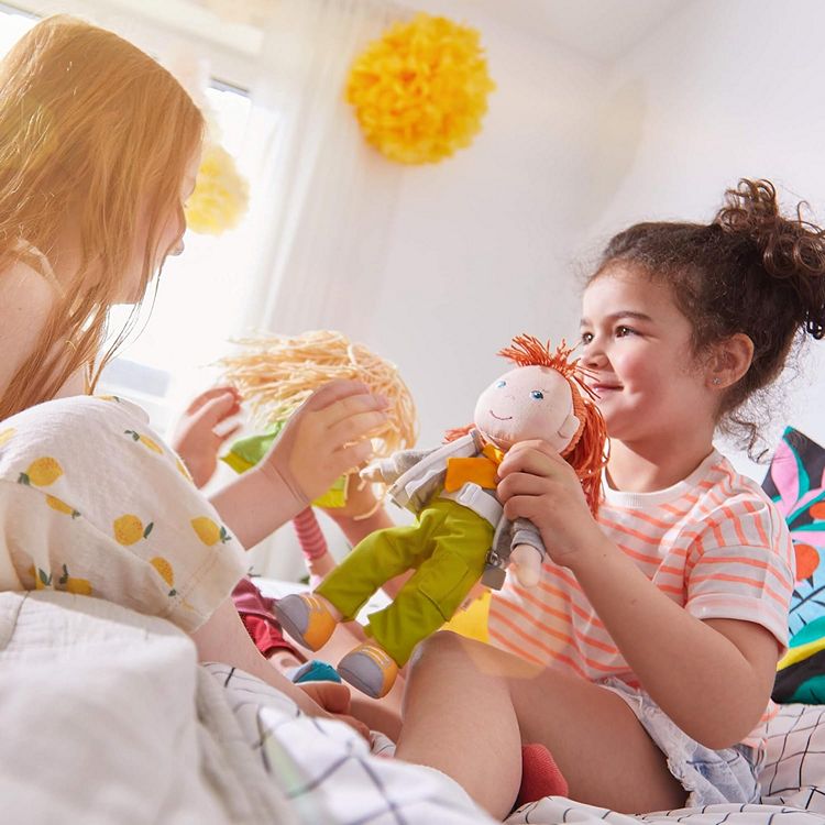 little girls playing with their dolls including redhead rag doll of the year Soley by HABA