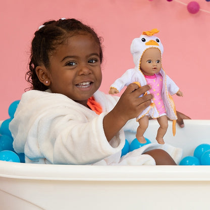 A Black Child Model holds Adora Doll Baby tots Ducky Bathtub doll