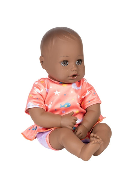 Piper has a removable swim dress and is a quickdri™ black baby doll
