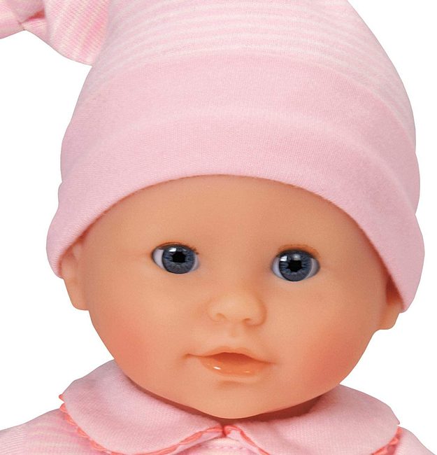 a close up portrait of Corolle's Calin Charming Pastel baby doll