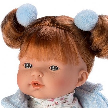 Close up portrait of a beautiful redhead children's doll