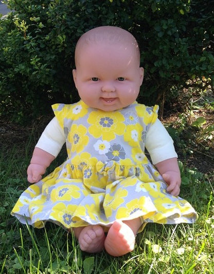 Cuddle Me Life-sized doll in real baby's dress size 3-6 months