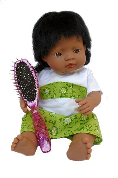 A fifteen inch doll with synthetic hair holding a doll's hair brush