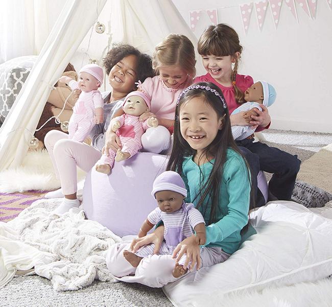 A group of girls playing with dolls