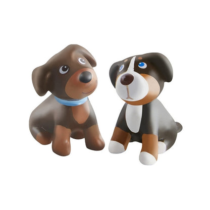 Picture of the two puppies that come in HABA's Little Friends line of dollhouse dolls and accessories
