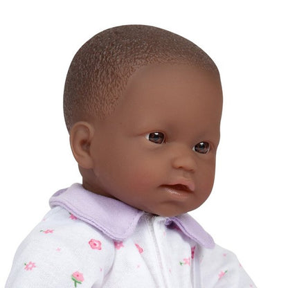 close up portrait of a small black baby doll for toddlers