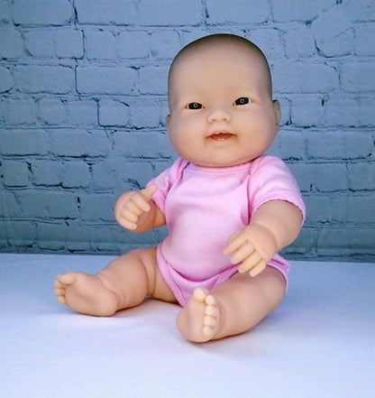 Asian Baby Doll shown in the bonus baby's crawler outfit from BestDollsForKids.com