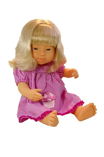 Here is our blonde girl down syndrome doll in one of several available doll's dress