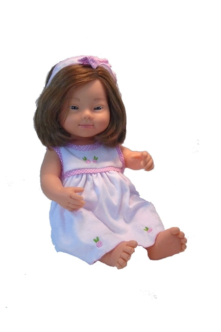 Cheryl Down Syndrome Doll in a sleeveless knit doll's dress