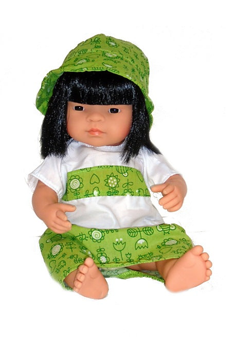 A 15 inch Asian Girl Doll dressed in a colorful green and white dress and sun hat outfit