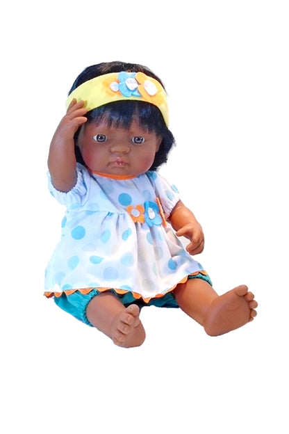 An all vinyl desi doll for children in the big blue dots outfit