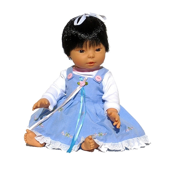 13 inch all vinyl Asian baby doll with hair in beautiful dress