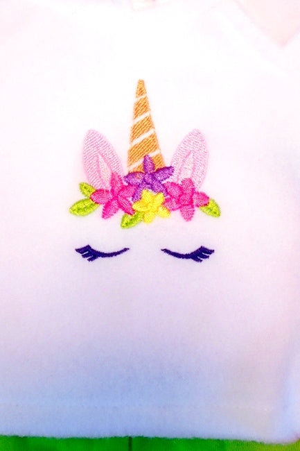 close up of the embroidery of the gay pride unicorn on our 15 inch doll outfit