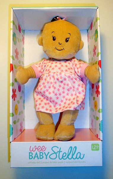 a beige wee baby stella in its package, a standing open box