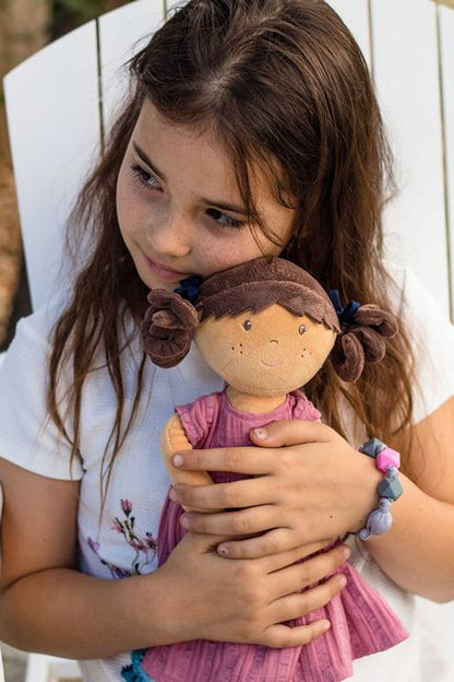 The necklace on the Bonikka Mandy Doll becomes the friendship bracelet for the little girl shown holding the doll