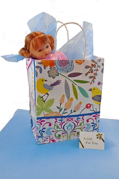 Pictured is BestDollsForKids.com gift bag option for small dolls that aren't boxed.