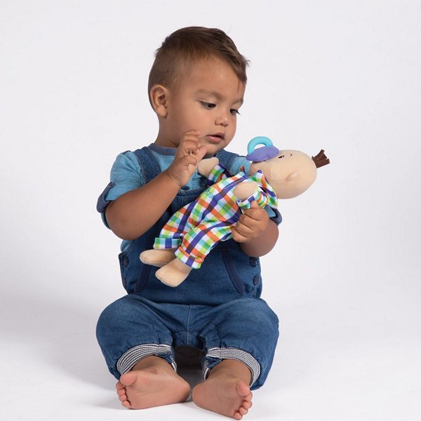 a young boy playing with a wee baby fella cloth boy's doll